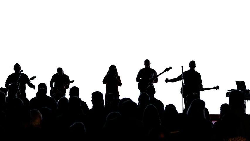 group of people playing instruments near each other