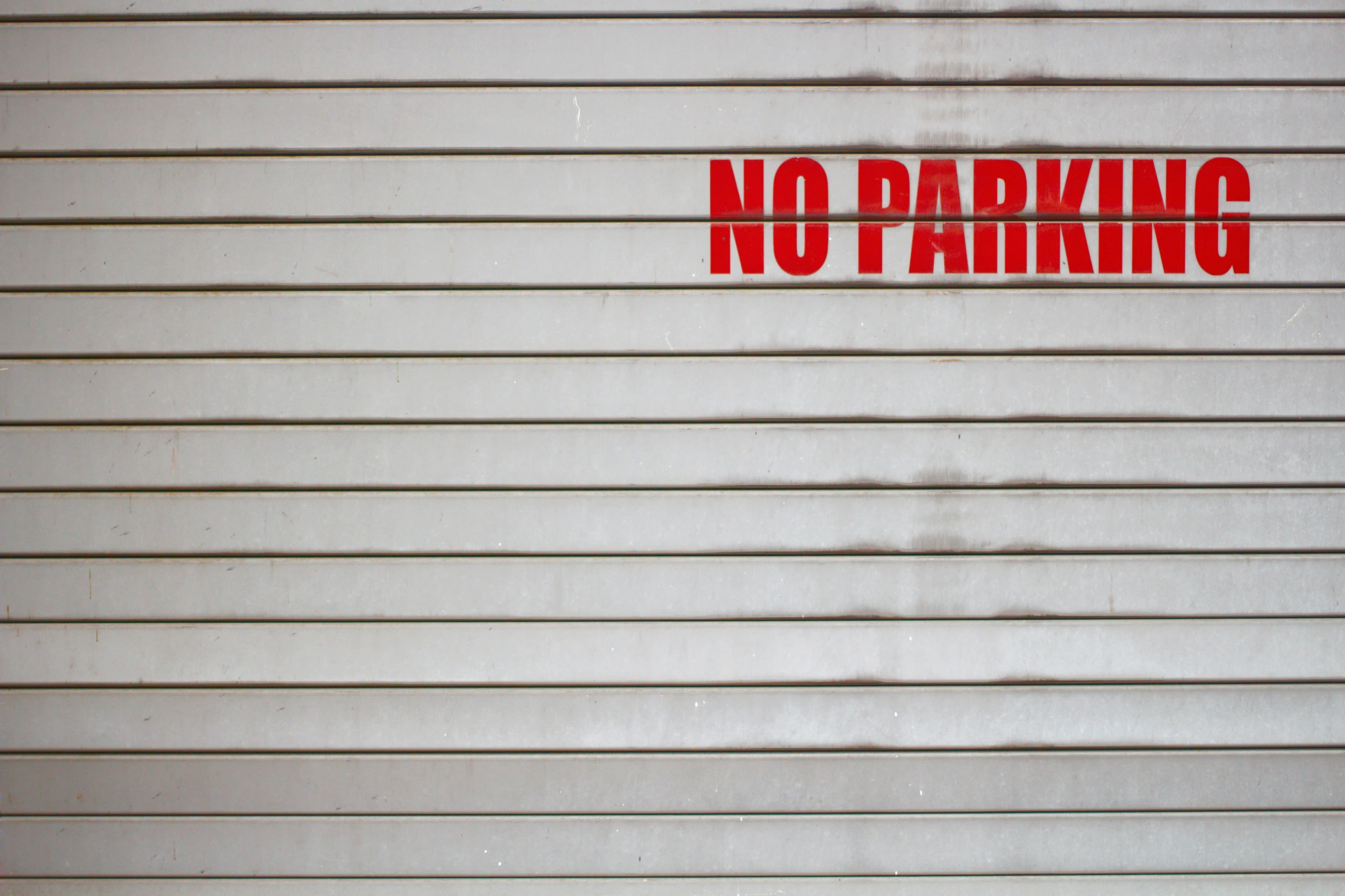 the sign reads no parking on a white background