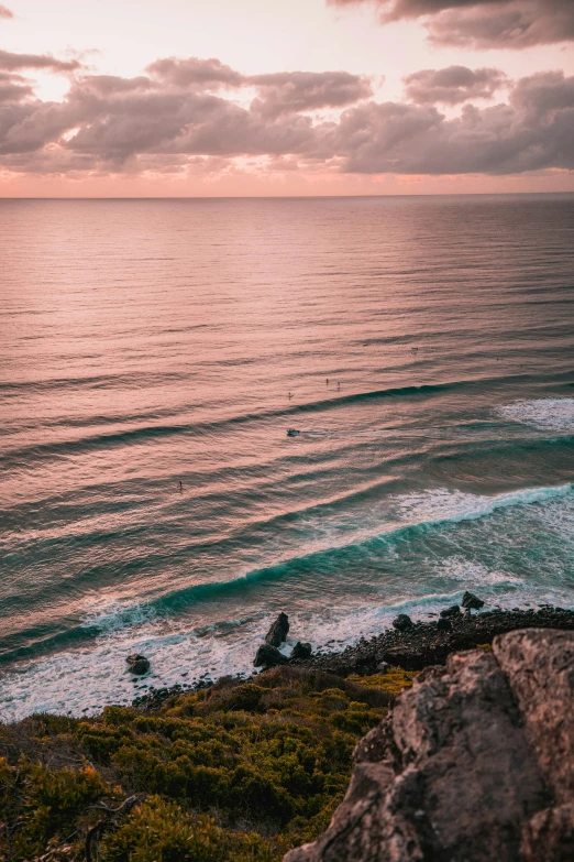 a man is walking towards a body of water