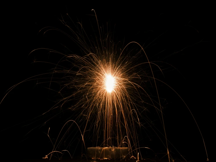 fireworks on a black sky and one large