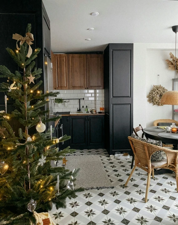 a decorated christmas tree sitting in front of a window