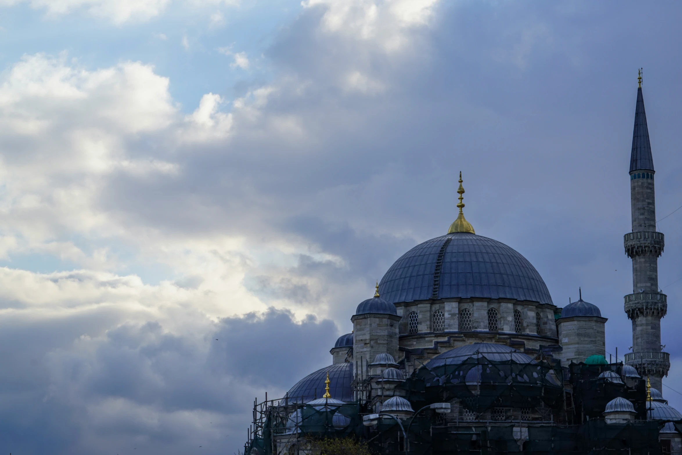 an ornate dome with many spires and a clock