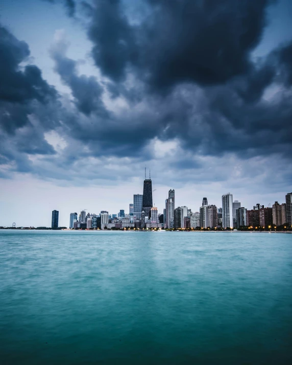 the ocean has a lot of dark clouds coming in