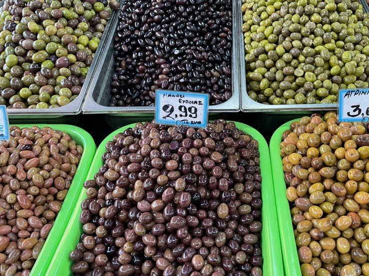 a couple boxes filled with lots of olives