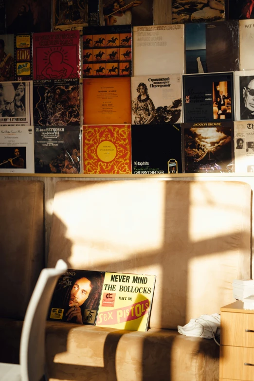 an open book sits in front of the wall covered with books