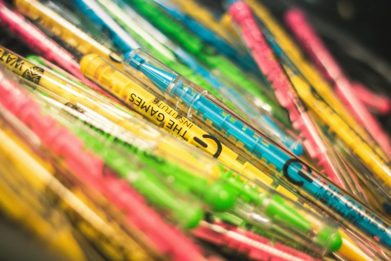 a collection of colorful crayons sit together