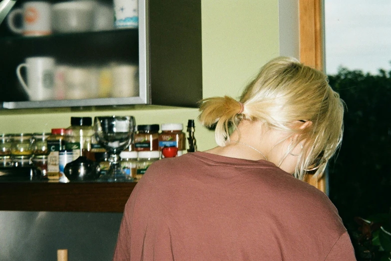 woman in the kitchen with ponytails wearing a ponytail