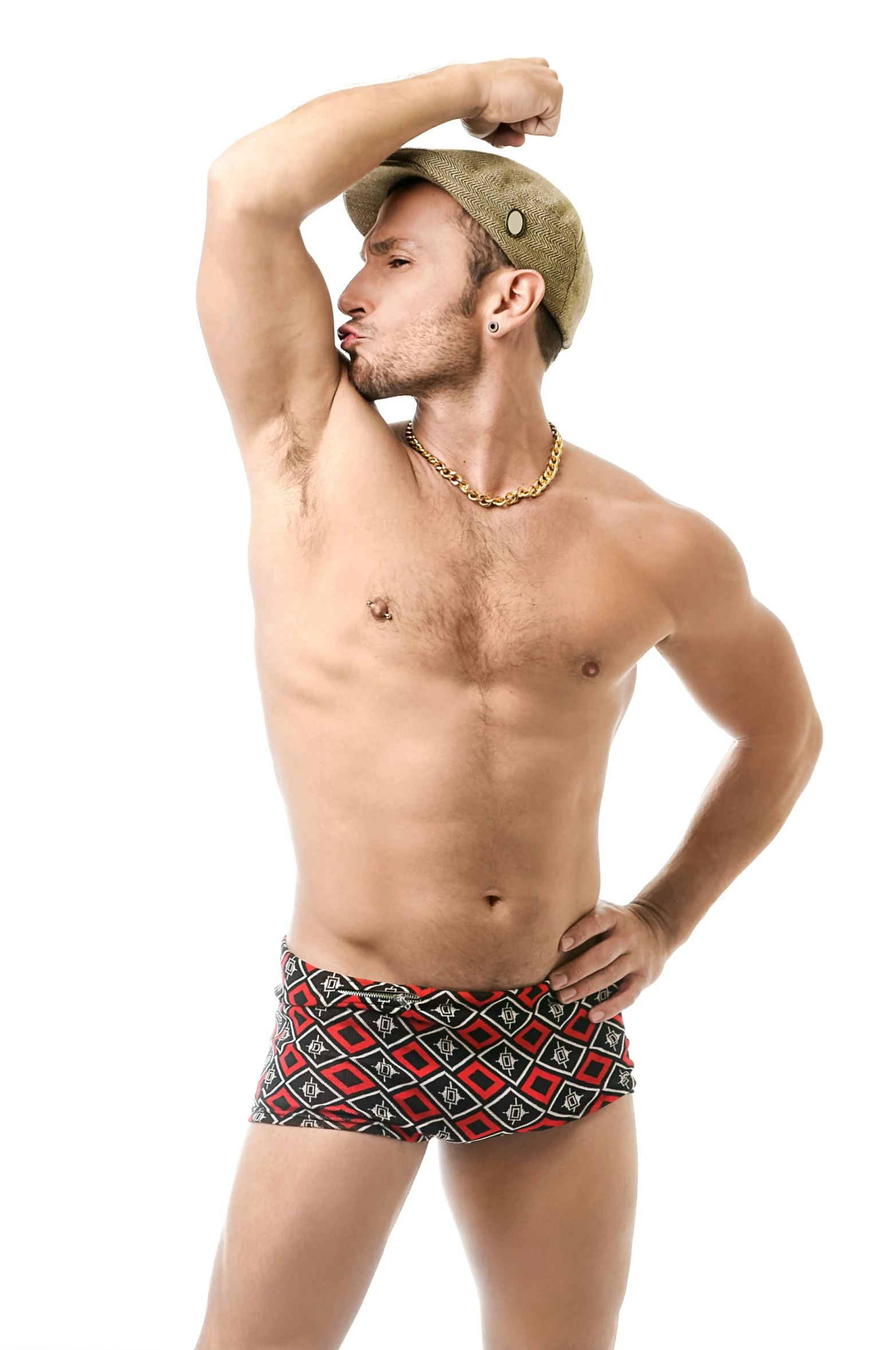 a shirtless man is wearing a hat and colorful shorts