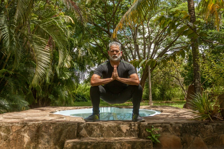 an older man in the midst of yoga