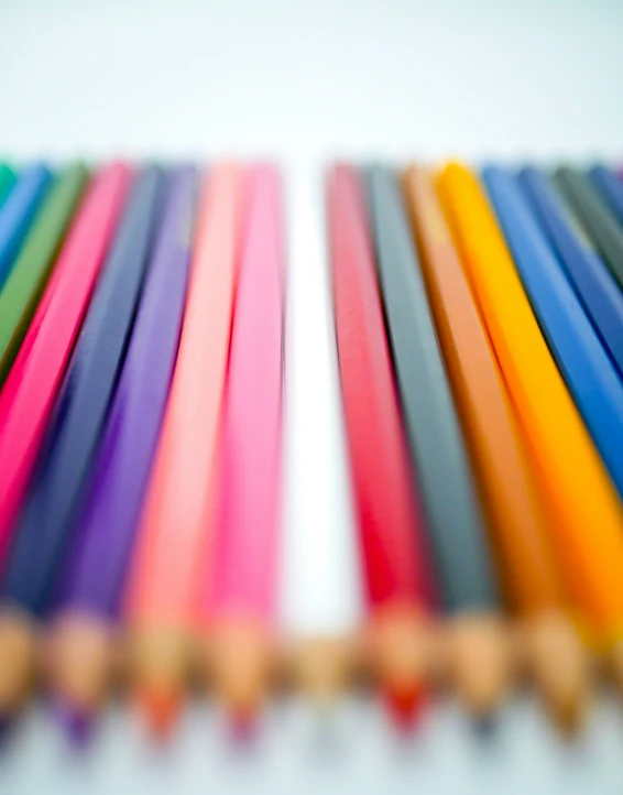 a close up of several colored toothbrushes