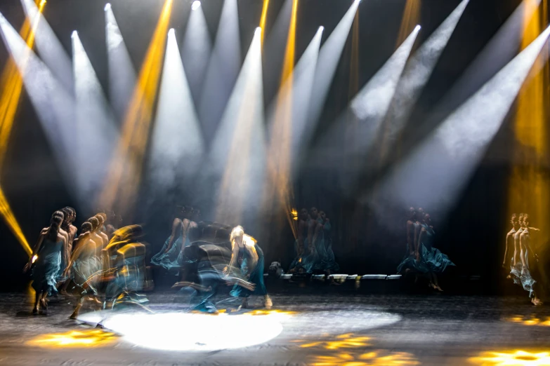a stage scene with spotlights shining on the scene