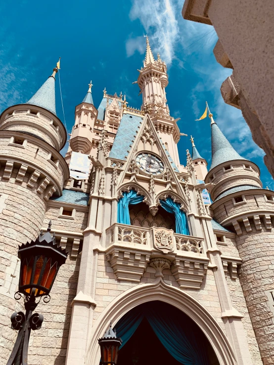 a castle with blue windows and a large clock