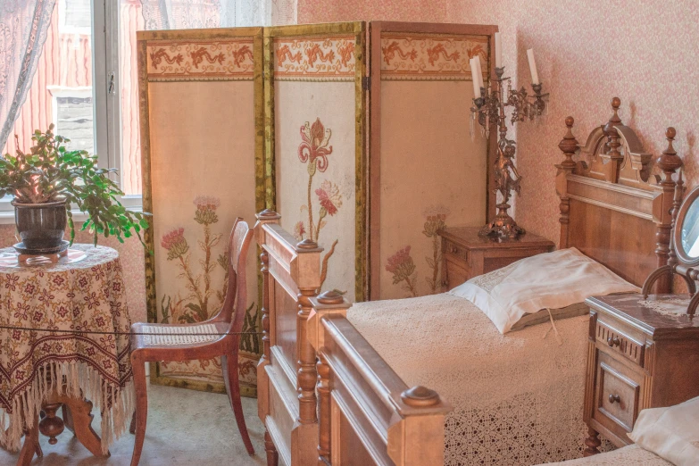 bedroom with furniture in front of window and wall paper