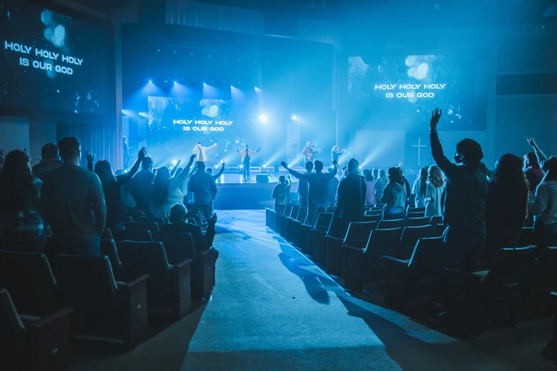 a group of people sitting at a stage