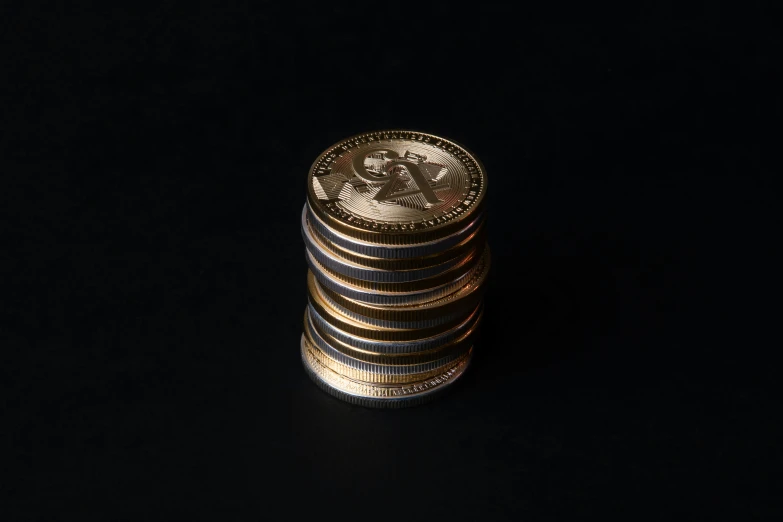 stacked coins on a black background