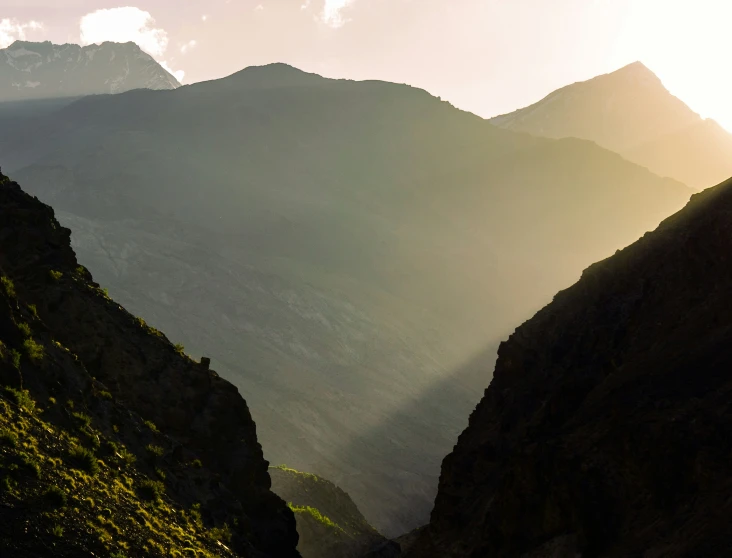 an upward view of some mountains in the distance