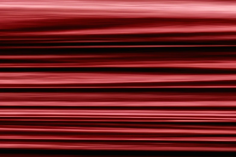 an image of blurred red fabric with the lines in it