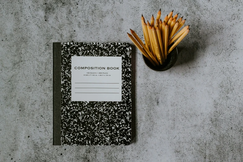 a book of matches are next to a bunch of straws