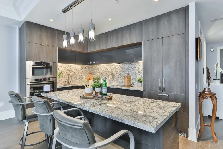 a large kitchen with white counter tops next to an oven