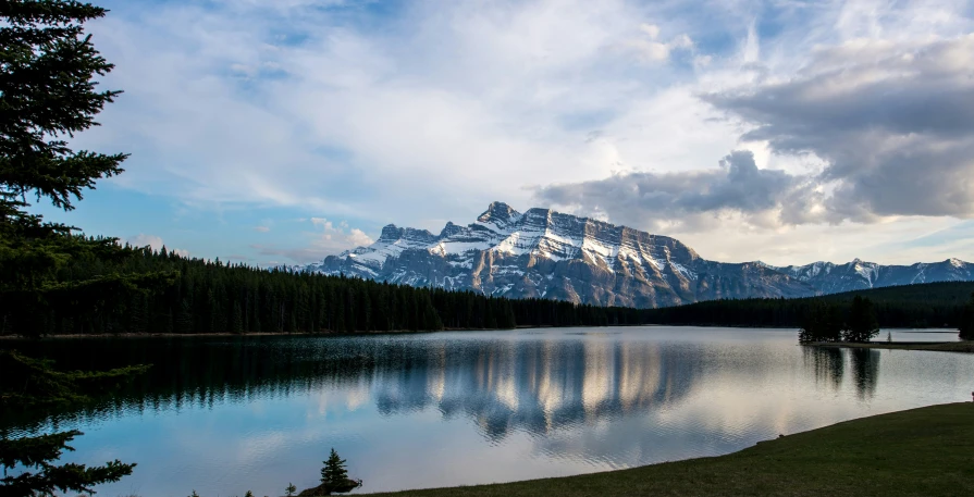 a body of water with mountains in the background