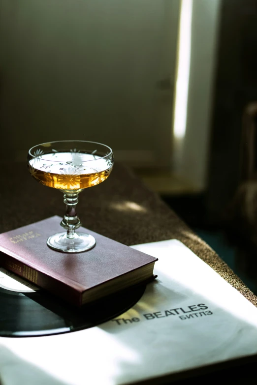 a single glass of liquor on a table