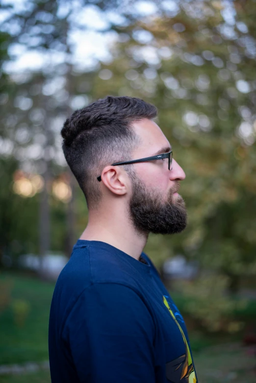 a man with a medium sized beard in a blue shirt