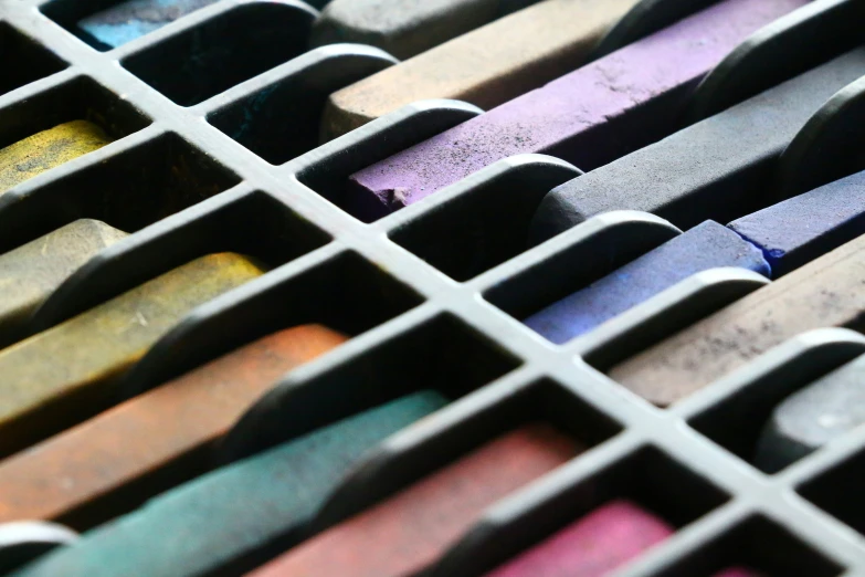 a group of pencils sitting inside of a box