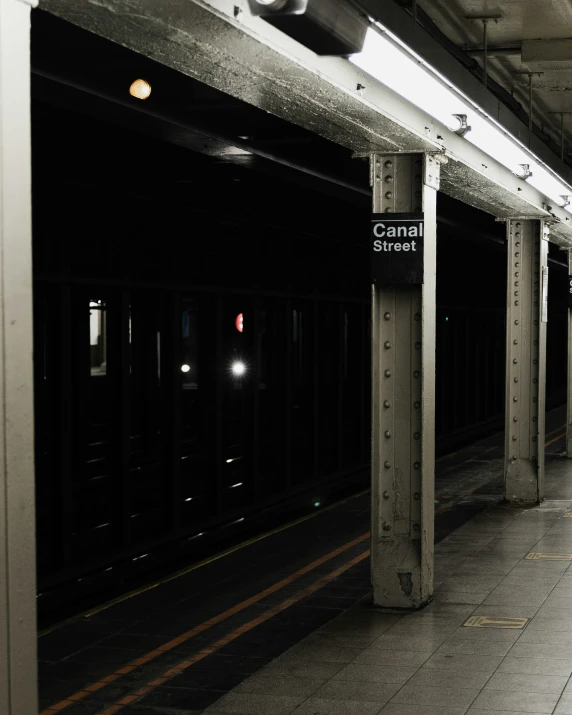 a subway station in the dark, with no people