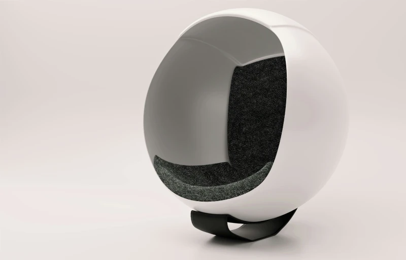 an egg shaped chair sitting on top of a stand