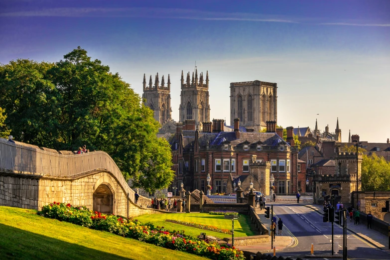 an old - fashioned landscape scene features buildings and a brick gate