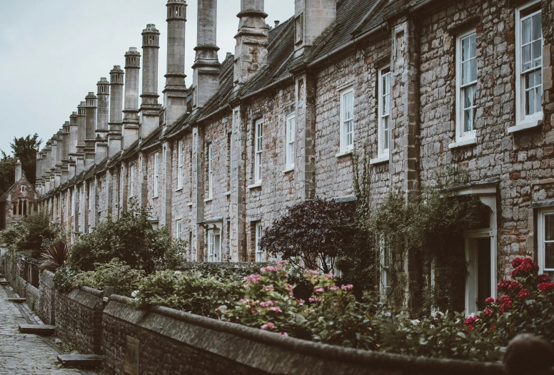 a row of brick buildings on a sidewalk