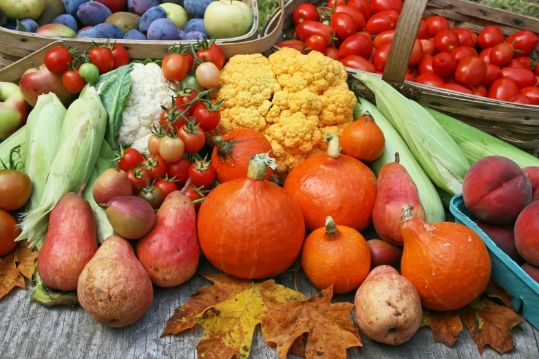 a wooden table topped with assorted produce and fruits