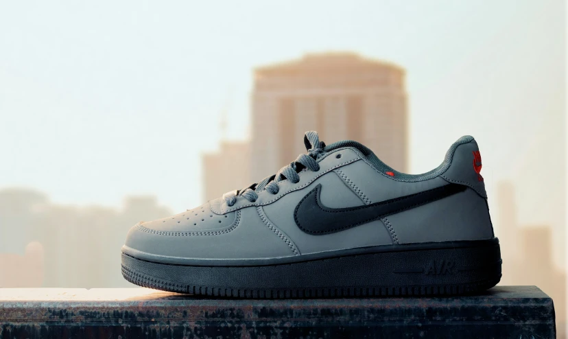 a nike air force one is sitting on a ledge