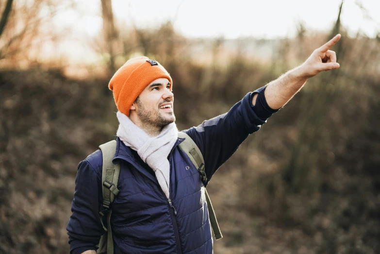 the man is wearing an orange hat