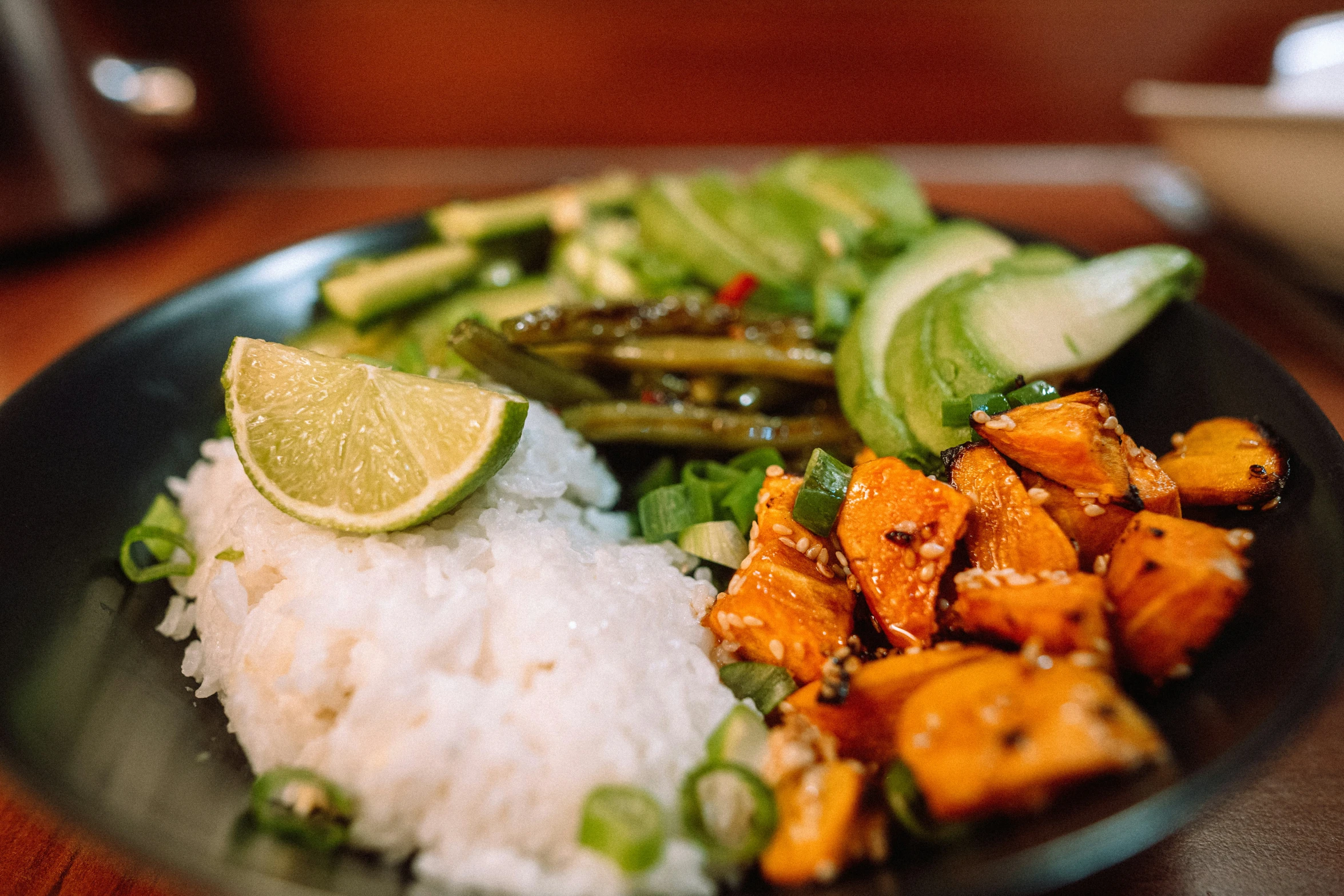 a plate filled with meat and vegetables on top of rice