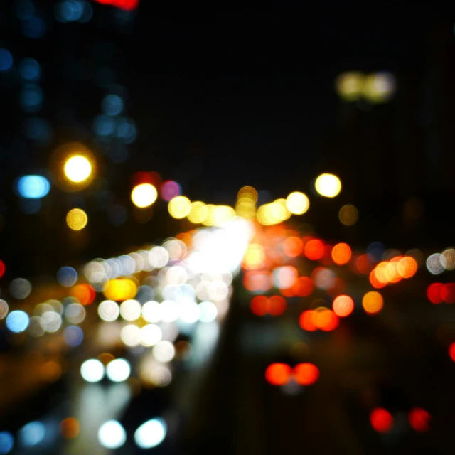 street full of car lights in the night