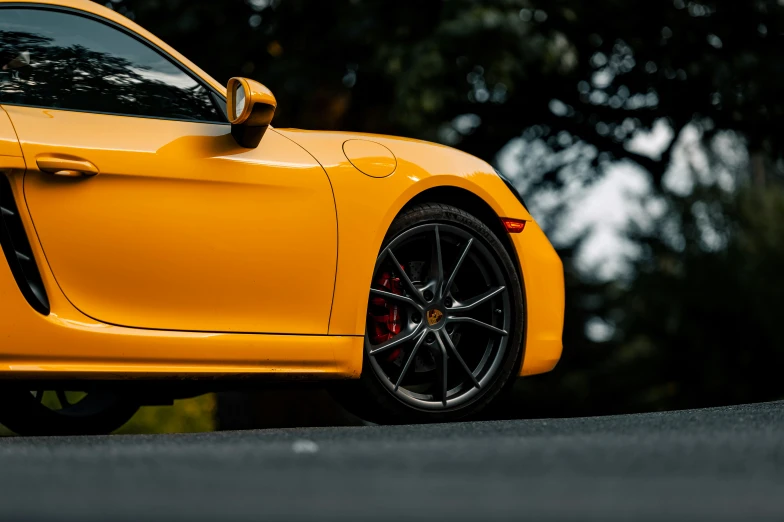 close up of the rear end of an orange sports car