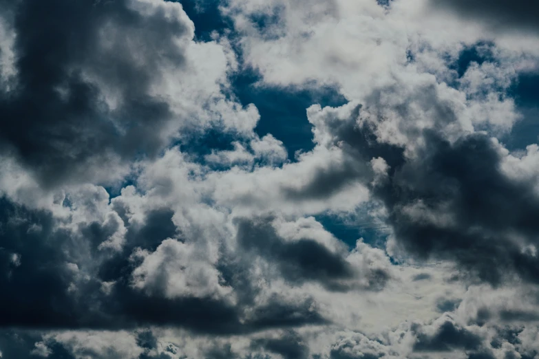 some clouds that are in the sky on a sunny day