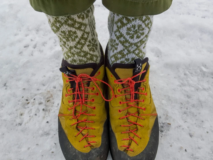 someone wearing hiking boots and green socks