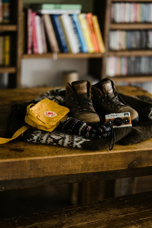 shoes and other items on a wooden table