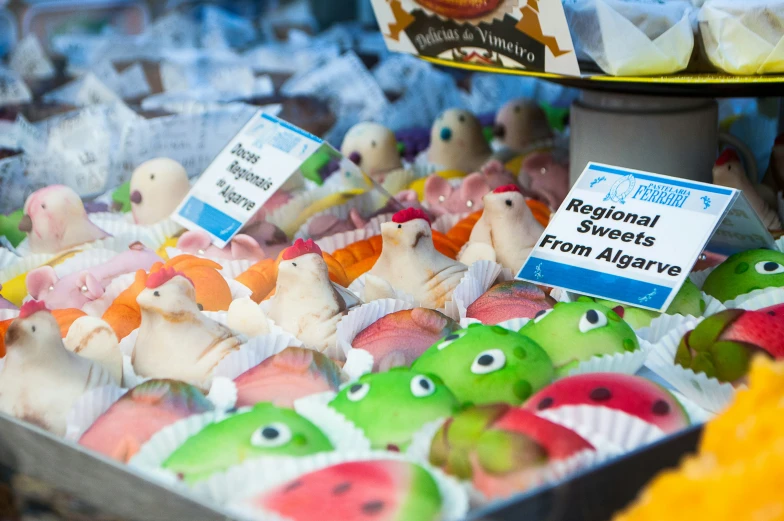 a lot of stuffed animals are sitting for sale