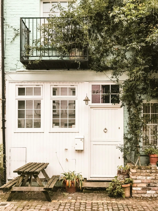 a house is shown with white doors and windows