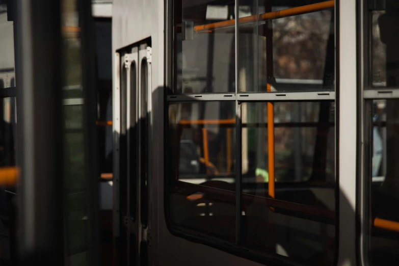 the window of a large bus in the day