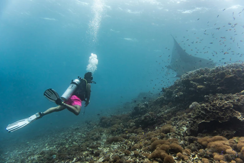 a woman snors near a diving statue