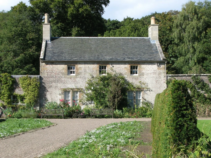the stone house has a stone path to the outside
