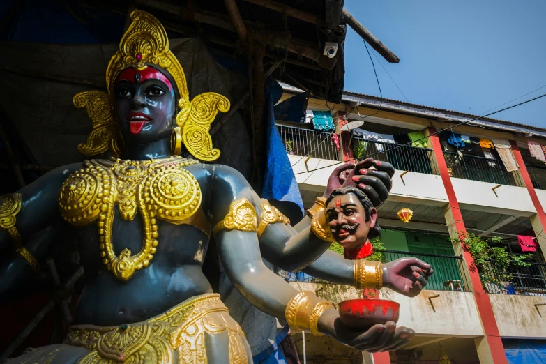 statues are arranged in various colors to decorate a street