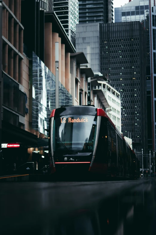 a transit bus is riding through the busy city streets