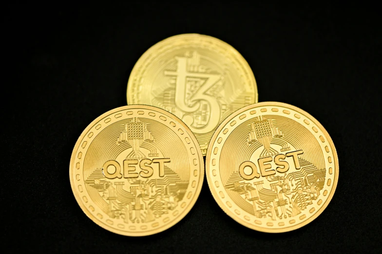 three gold coin on a black background