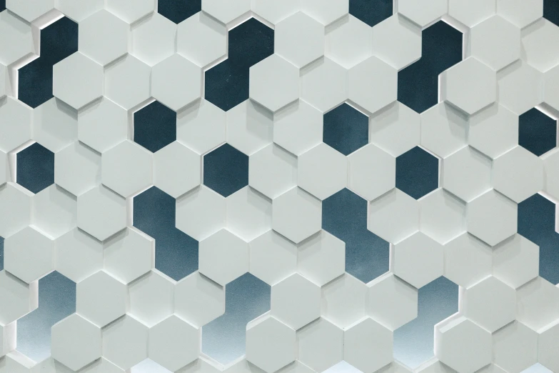 a large number of square and hexagonal shapes on a wall