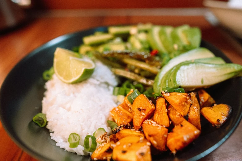 a plate of food with vegetables and white rice